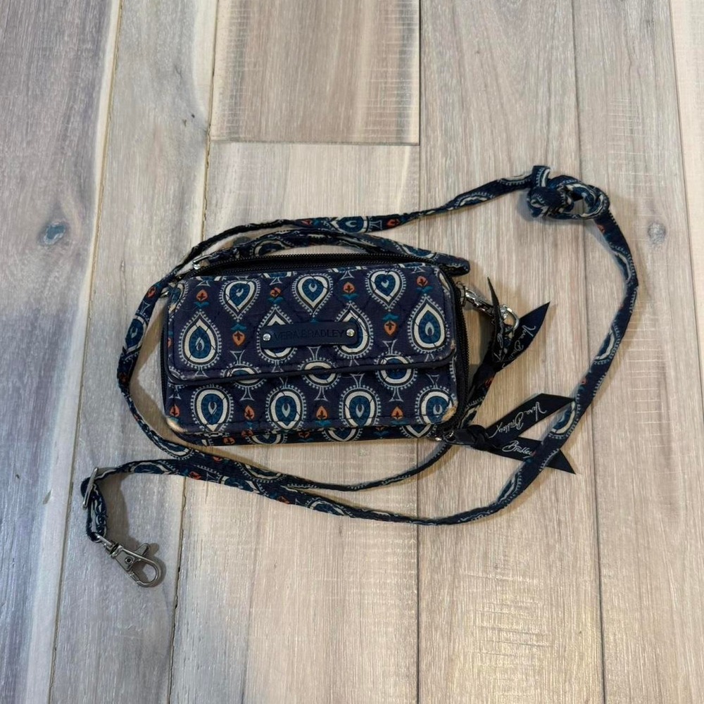Vera Bradley navy crossbody bag with adjustable strap
